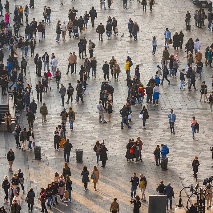 Busy pedestrian crowd at Piazza del Duomo, Milan, Italy