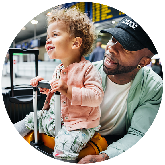 Man holding daughter on his lap