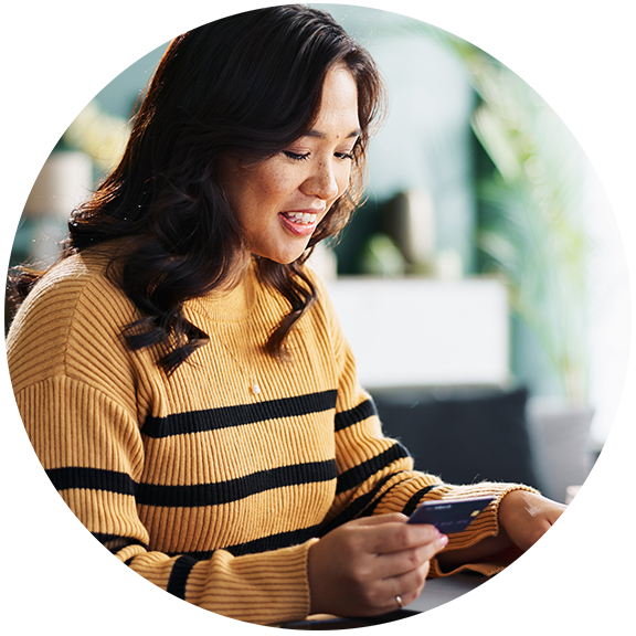woman entering credit card information on her computer