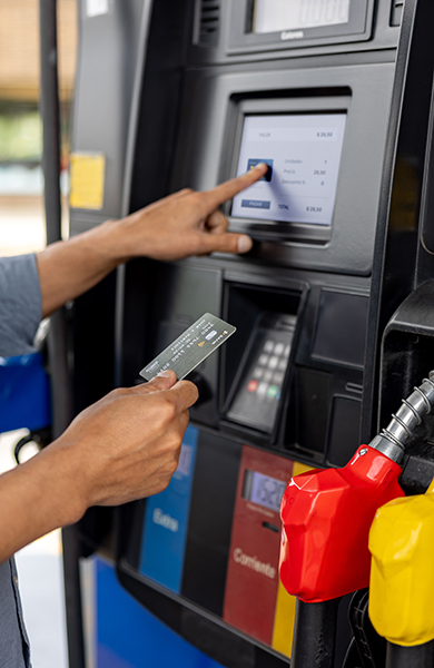 Man paying by card at a gas station