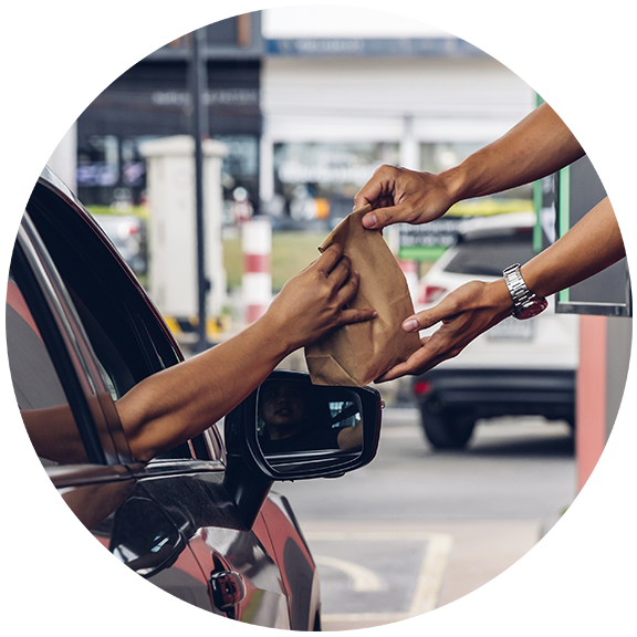 Person getting food at drive through