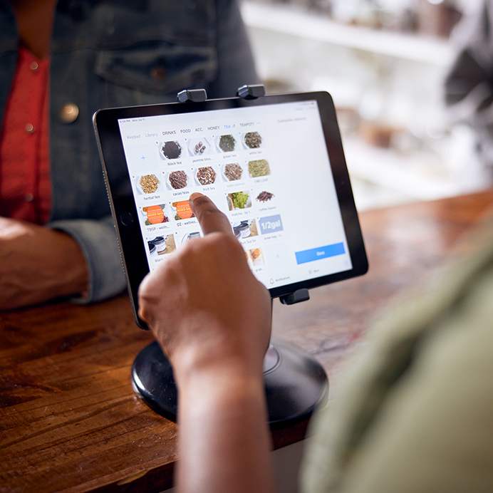 Employee uses point of sale app on tablet